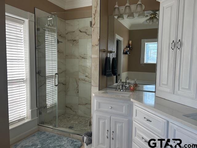 bathroom featuring ornamental molding, an enclosed shower, and vanity