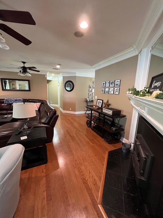 living room with ornamental molding and hardwood / wood-style floors