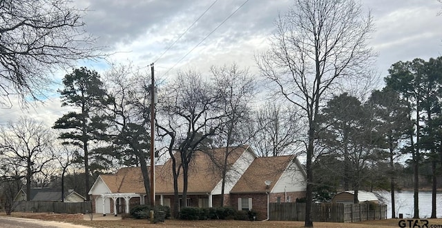 view of home's exterior featuring a water view