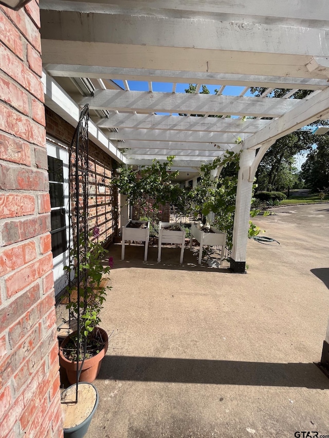 view of patio featuring a pergola