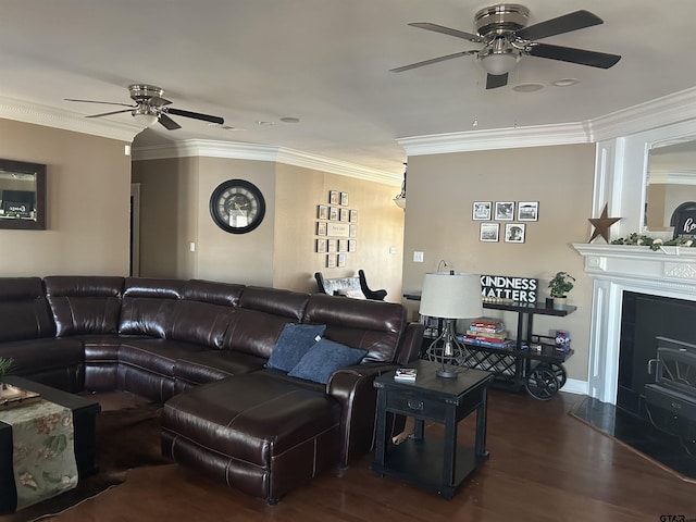 living room with ornamental molding, dark hardwood / wood-style floors, and ceiling fan