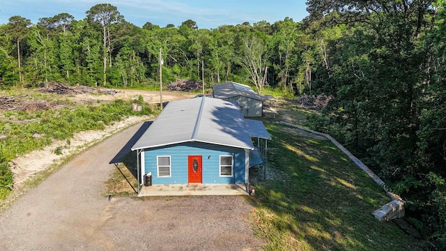view from above of property with a forest