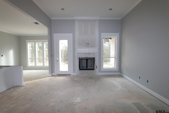 unfurnished living room with a large fireplace and ornamental molding