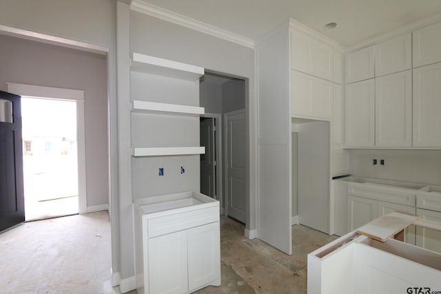 kitchen featuring white cabinetry and ornamental molding