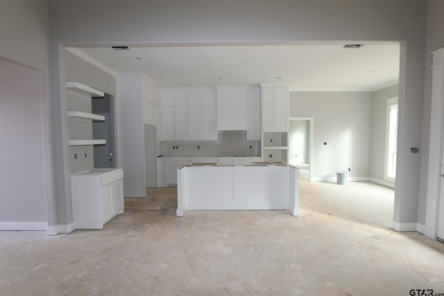 kitchen featuring white cabinetry and ornamental molding