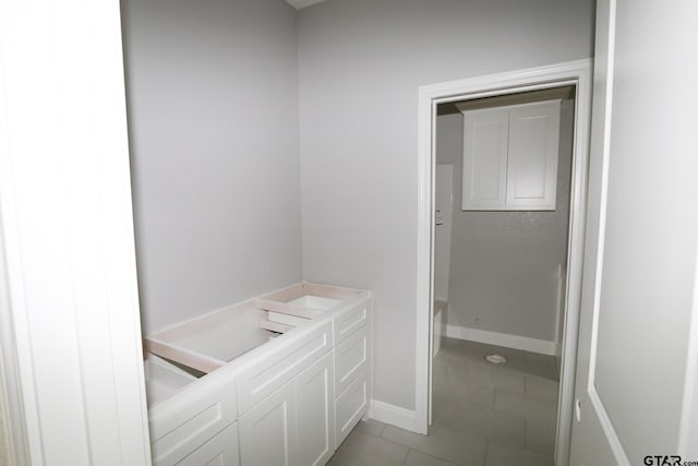 bathroom with tile patterned floors and vanity