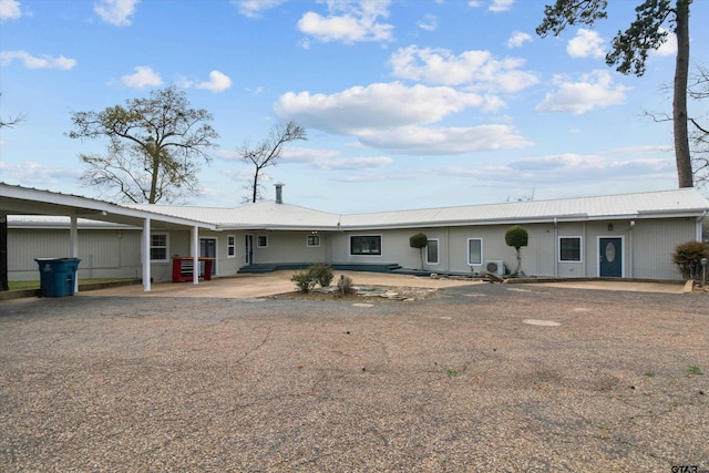 view of front of home with a carport