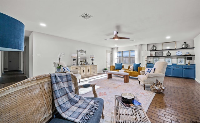 living room with visible vents, recessed lighting, brick floor, baseboards, and ceiling fan