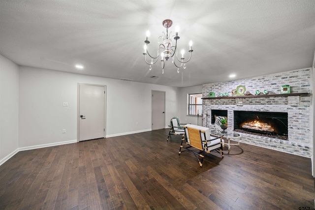 unfurnished room featuring visible vents, a fireplace, baseboards, and wood-type flooring