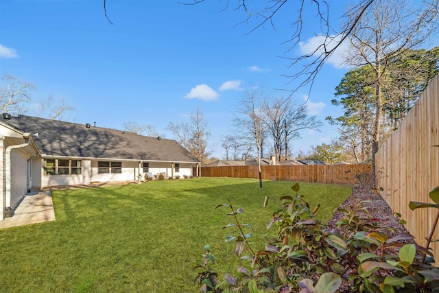 view of yard with a fenced backyard