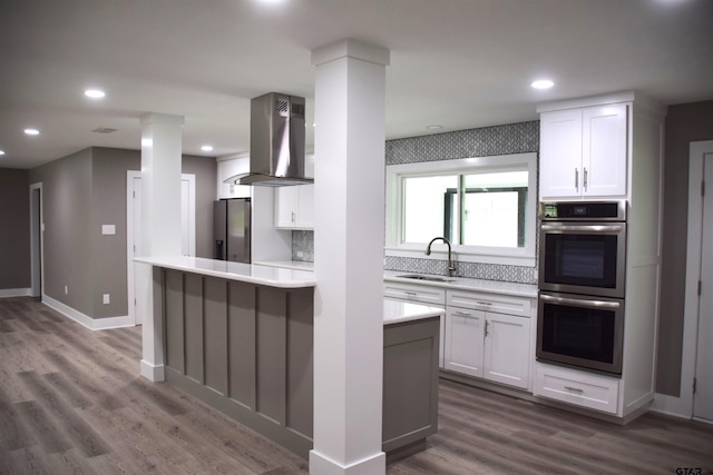 613 Northgate Rd, Hideaway, TX 75771 - kitchen featuring a sink, ventilation hood, white cabinetry, light countertops, and appliances with stainless steel finishes