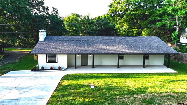613 Northgate Rd, Hideaway, TX 75771 - view of front of home with roof with shingles, fence, a front lawn, and a chimney