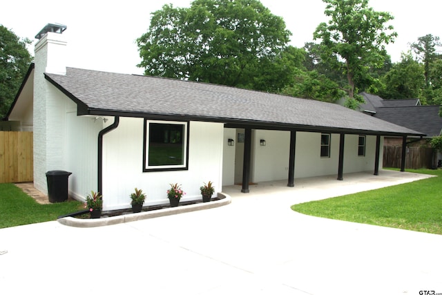 613 Northgate Rd, Hideaway, TX 75771 - ranch-style home with fence, a patio, a front yard, a chimney, and a shingled roof