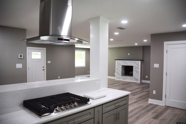 613 Northgate Rd, Hideaway, TX 75771 - kitchen with extractor fan, visible vents, light countertops, light wood-style floors, and stainless steel gas cooktop