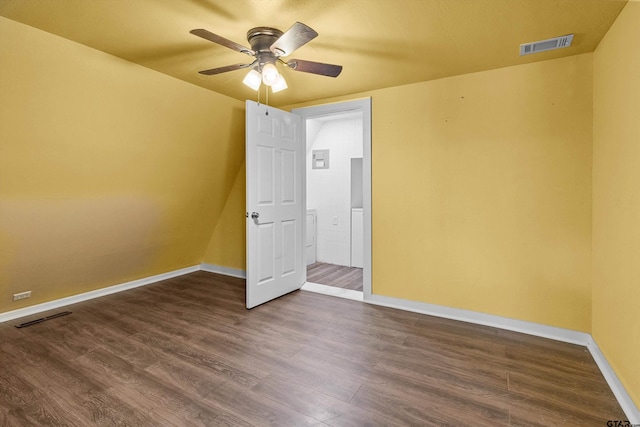 unfurnished bedroom featuring ceiling fan and dark wood-type flooring