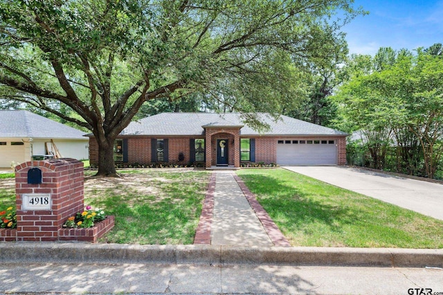 4918 Pine Knl, Tyler, TX 75703 - ranch-style house with a garage, brick siding, and concrete driveway