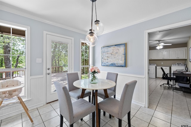 4918 Pine Knl, Tyler, TX 75703 - dining area with washing machine and dryer, light tile patterned flooring, a wainscoted wall, ornamental molding, and a desk