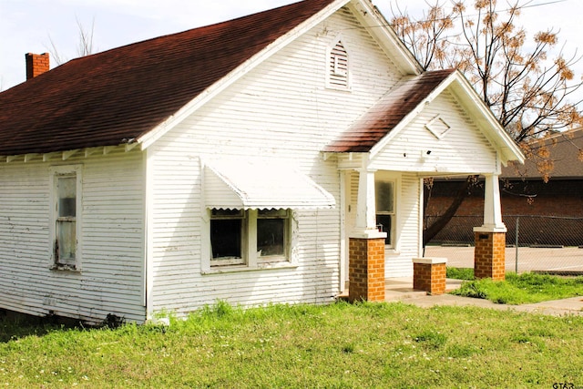 view of home's exterior with a yard