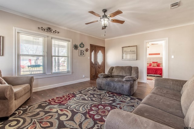 living room featuring dark wood-style floors, visible vents, and crown molding