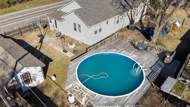 view of swimming pool with fence