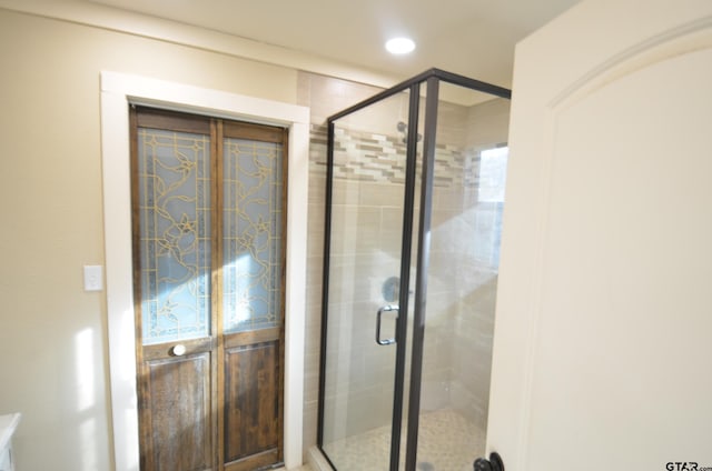 bathroom with an enclosed shower