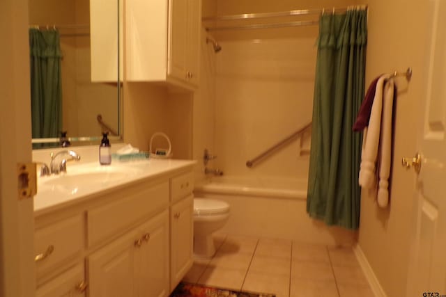 full bathroom featuring toilet, tile patterned flooring, shower / bath combo with shower curtain, and vanity