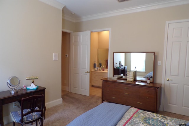 carpeted bedroom with crown molding and ensuite bath