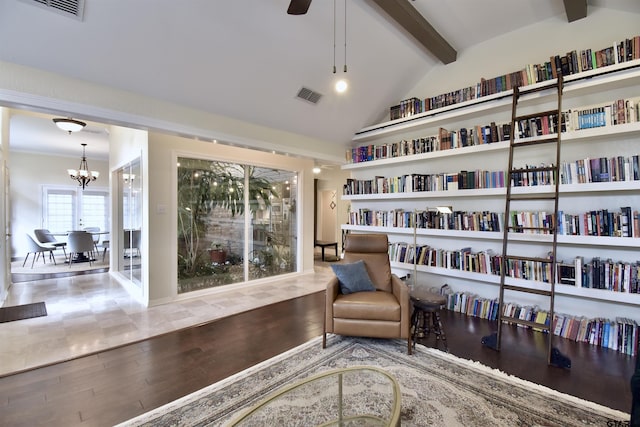 1406 Kingspark Dr, Tyler, TX 75703 - sitting room with a chandelier, wood finished floors, and ceiling fan
