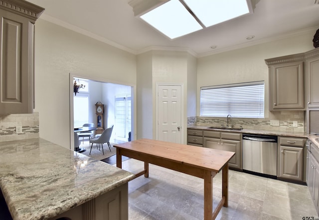 1406 Kingspark Dr, Tyler, TX 75703 - kitchen with stainless steel dishwasher, a sink, tasteful backsplash, a peninsula, and light stone countertops