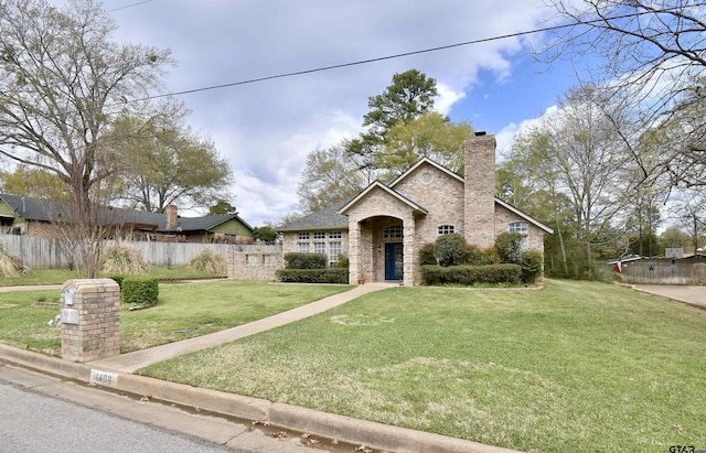 1406 Kingspark Dr, Tyler, TX 75703 - traditional-style home featuring a chimney and stone siding