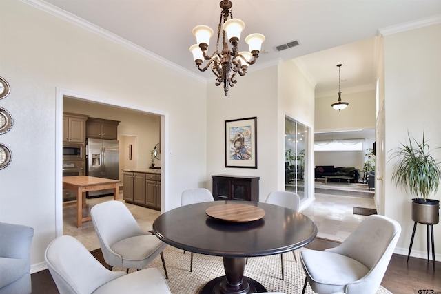 1406 Kingspark Dr, Tyler, TX 75703 - dining area with crown molding, a chandelier, and baseboards