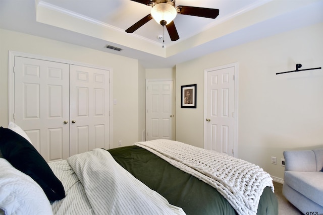1406 Kingspark Dr, Tyler, TX 75703 - bedroom featuring a raised ceiling, carpet flooring, a ceiling fan, ornamental molding, and baseboards