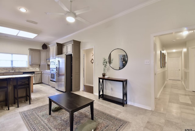 1406 Kingspark Dr, Tyler, TX 75703 - living area with ornamental molding, a ceiling fan, and baseboards