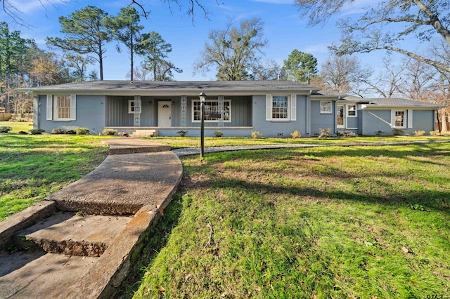 ranch-style house featuring a front yard and a porch