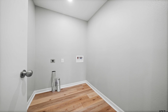 washroom with electric dryer hookup, hookup for a washing machine, and hardwood / wood-style flooring