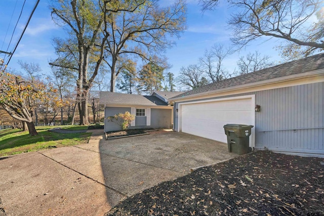 exterior space featuring a front yard and a garage