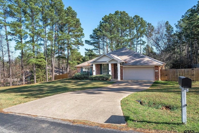 view of front of home featuring a front yard and a garage