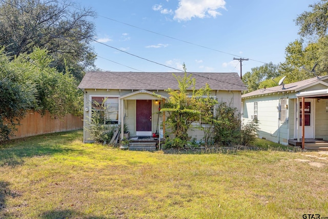 bungalow with a front lawn