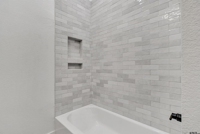 20224 Roebuck Dr, Bullard, TX 75757 - full bathroom featuring a textured wall and bathing tub / shower combination