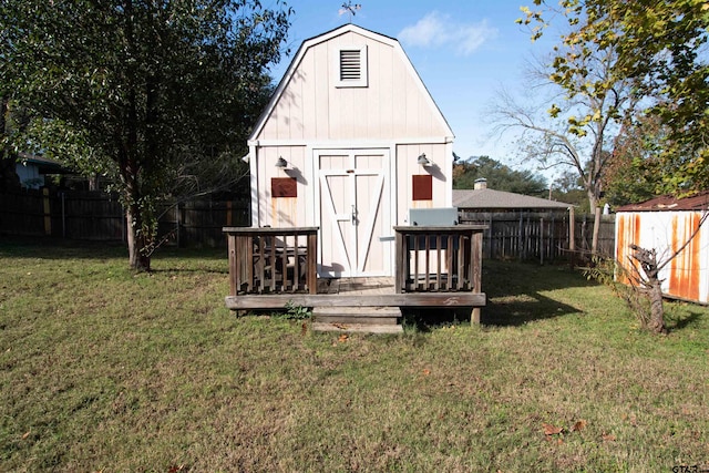 view of outbuilding featuring a yard