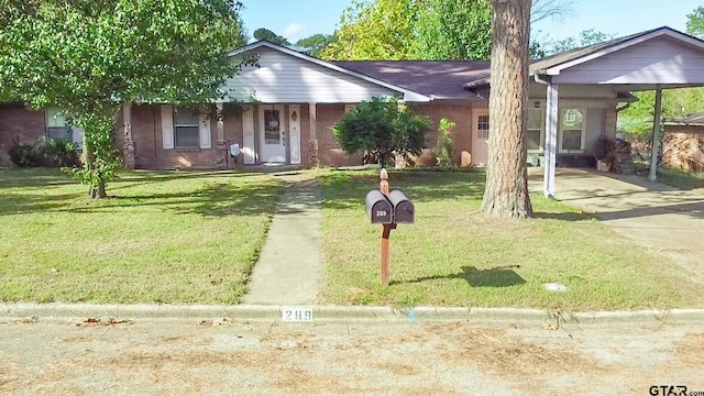 single story home featuring a carport and a front yard