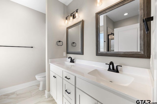 bathroom with toilet and vanity