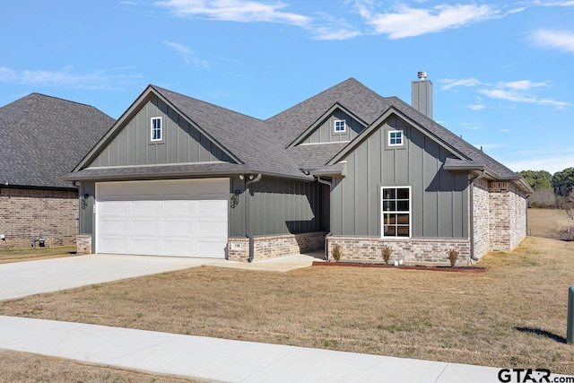 craftsman-style house with a front yard and a garage