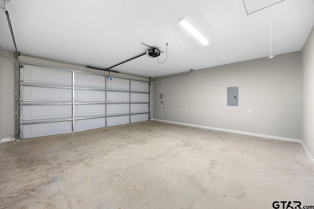 garage featuring electric panel and a garage door opener