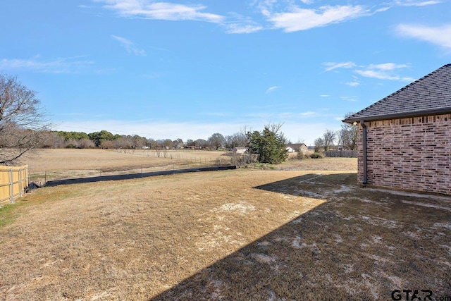 view of yard with a rural view