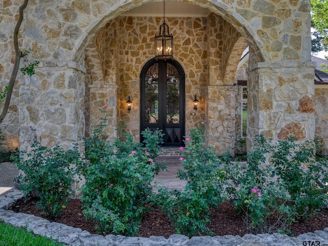 entrance to property featuring french doors