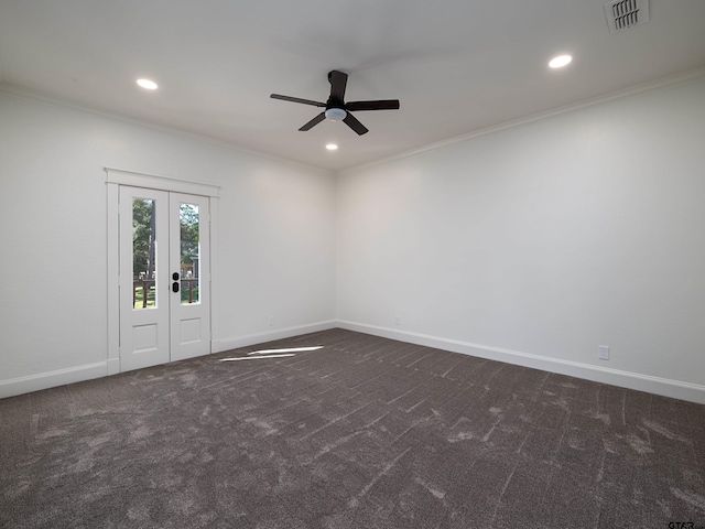 spare room with ornamental molding, ceiling fan, and dark carpet