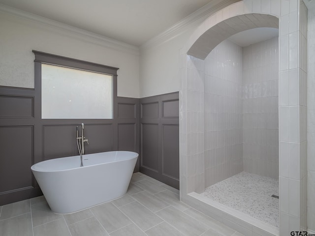 bathroom with ornamental molding, plus walk in shower, and tile patterned flooring