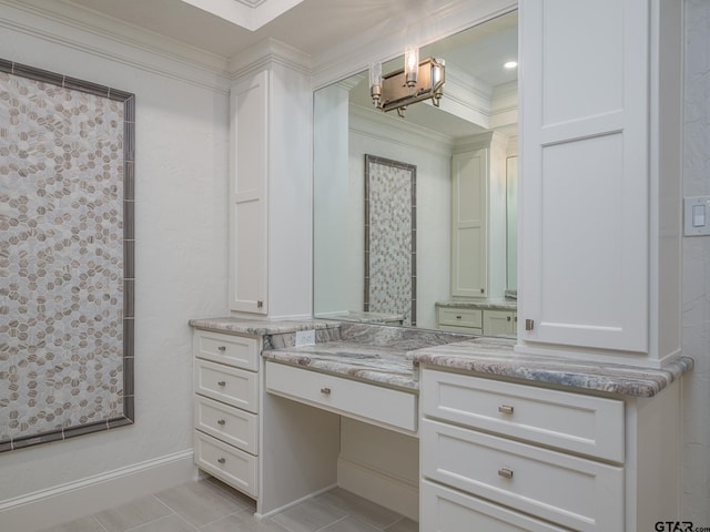 bathroom featuring vanity, ornamental molding, and tile patterned floors