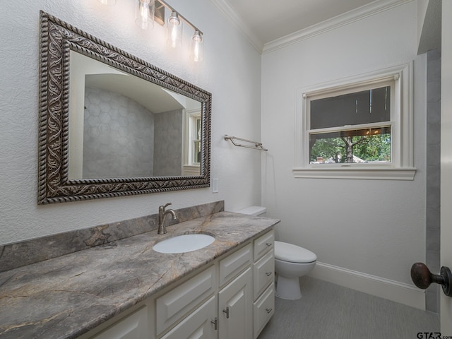 bathroom with vanity, ornamental molding, and toilet